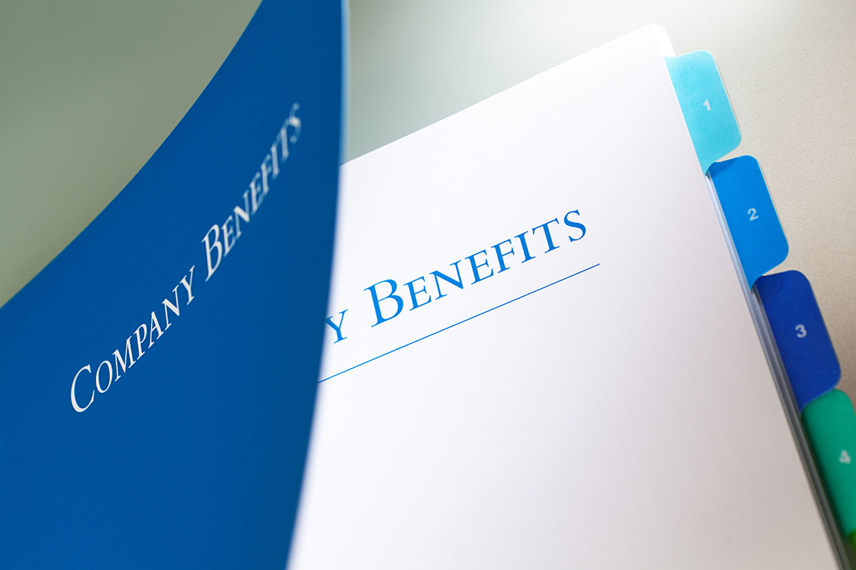 A folder with 'company benefits' written on it