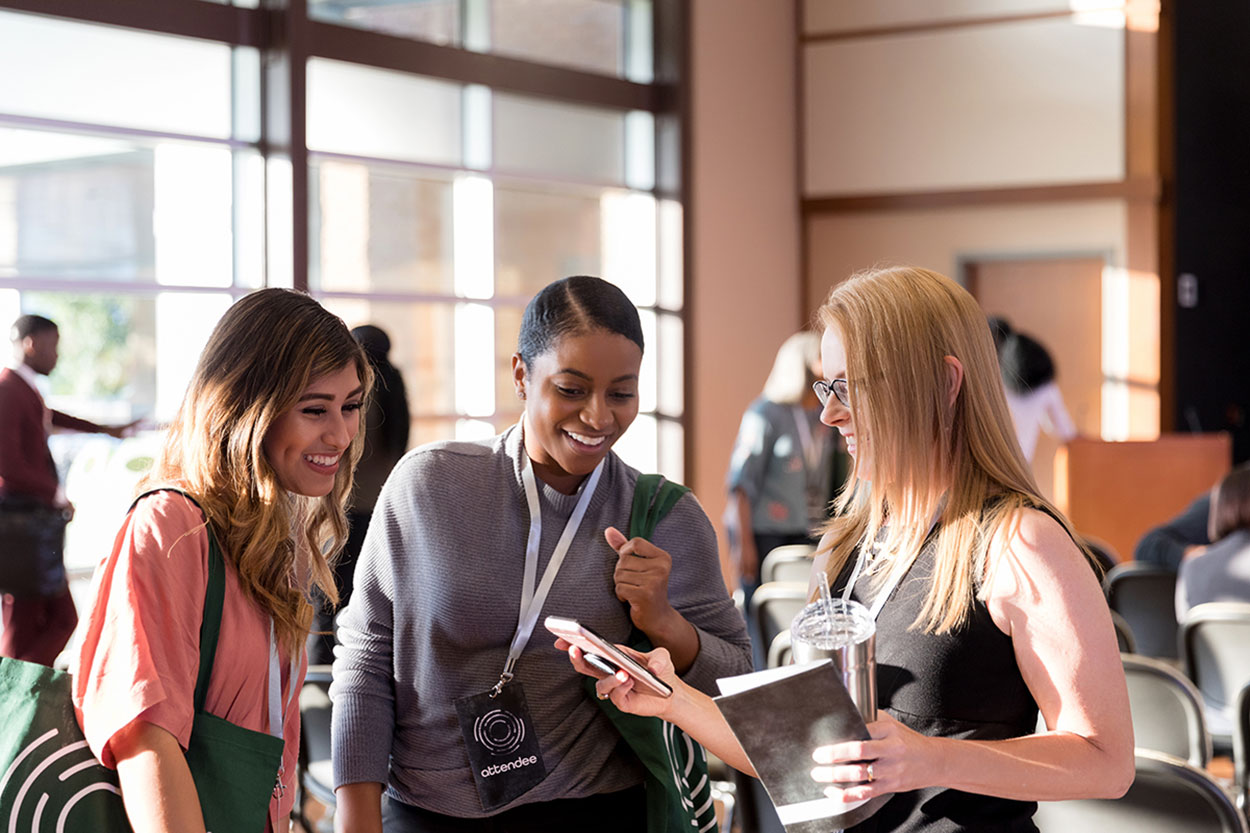 Three professional woman talking at a meeting