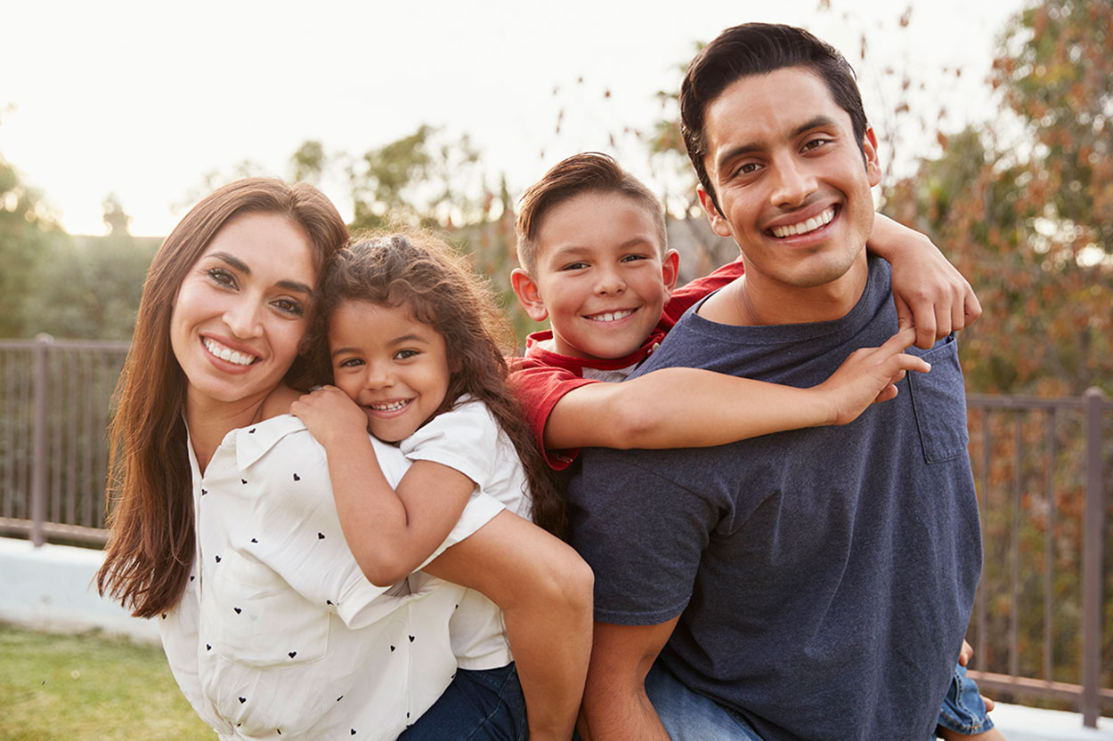 A happy couple with two kids