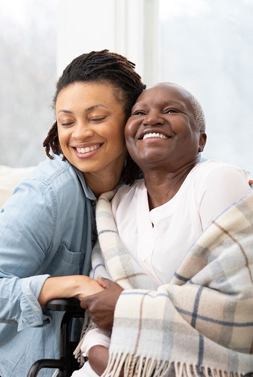 A caregiver talking care of a woman