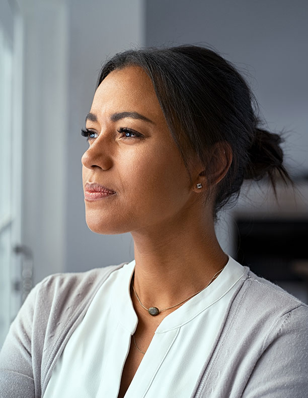 A woman thinking about something and looking into the distance